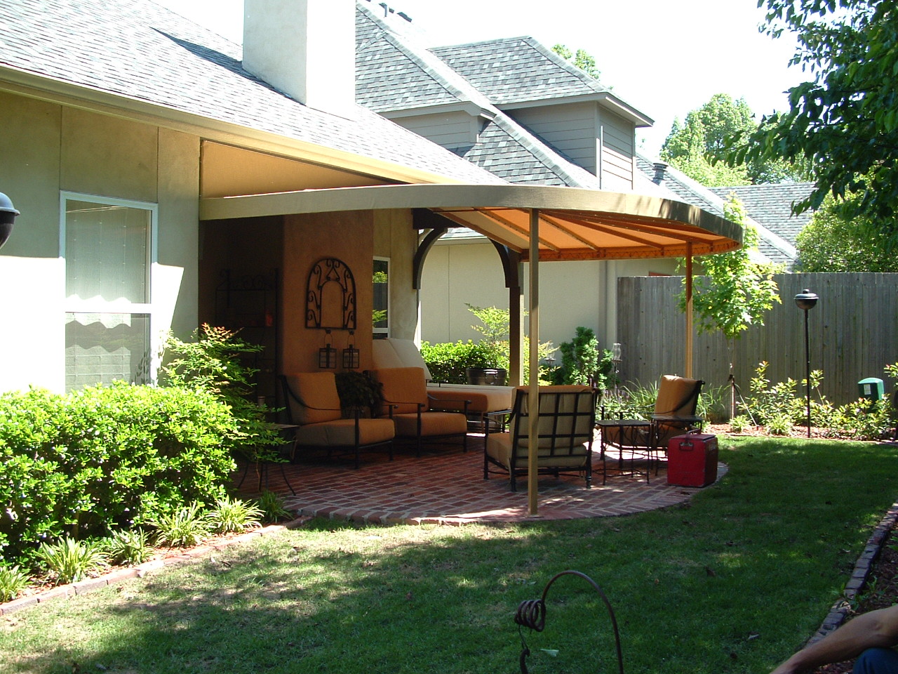 Curved front gabled patio awning.